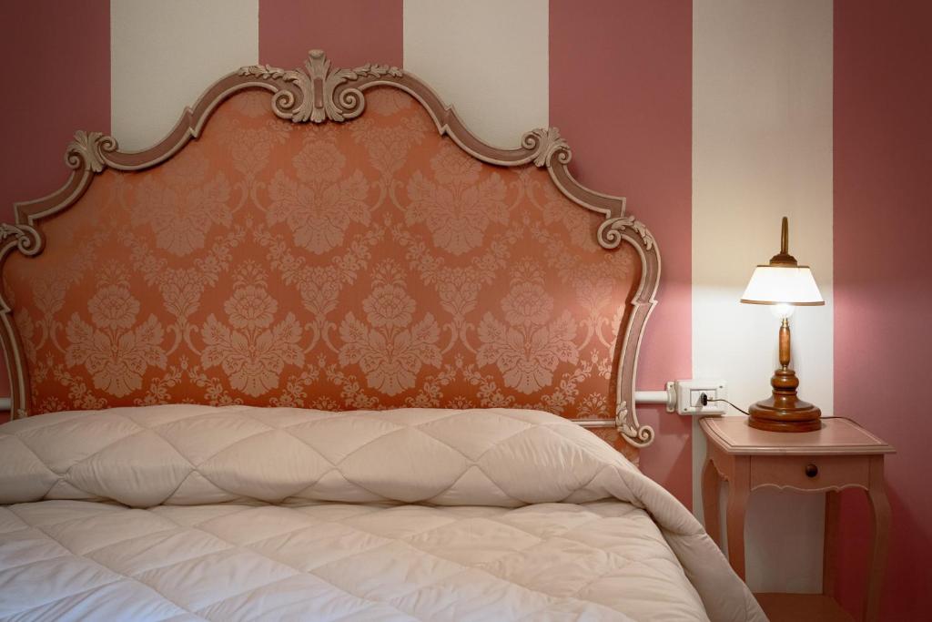 Postel nebo postele na pokoji v ubytování Hotel Rifugio la Foresta
