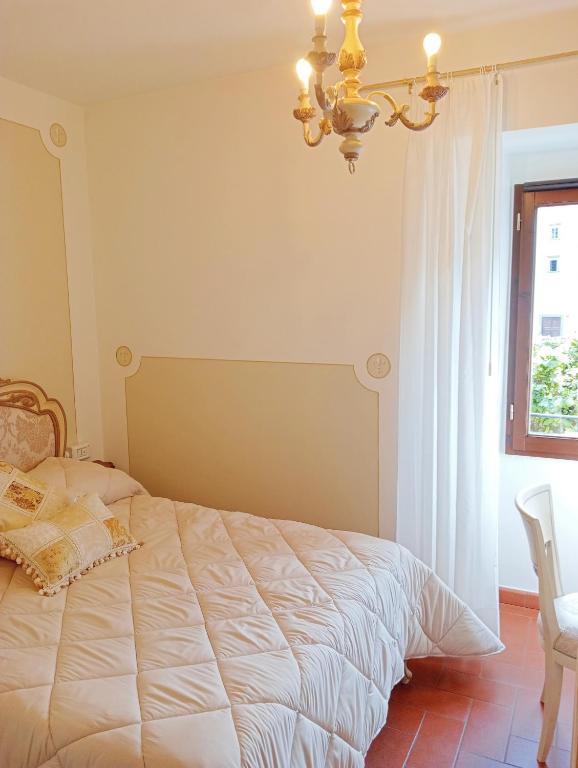Postel nebo postele na pokoji v ubytování Hotel Rifugio la Foresta