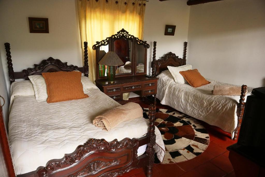 Postel nebo postele na pokoji v ubytování Posada el portal de la Loma