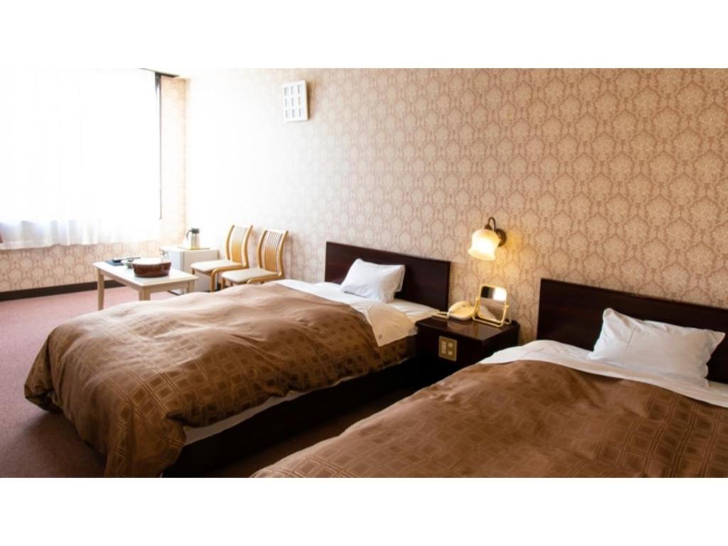 เตียงในห้องที่ Ashinomaki Prince Hotel - Vacation STAY 55341v