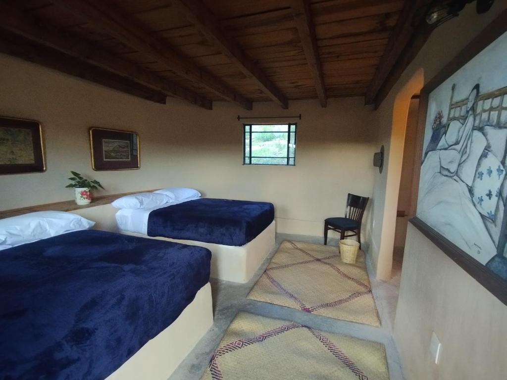 Postel nebo postele na pokoji v ubytování Chichi Jamaica Glamping Hotel Campestre