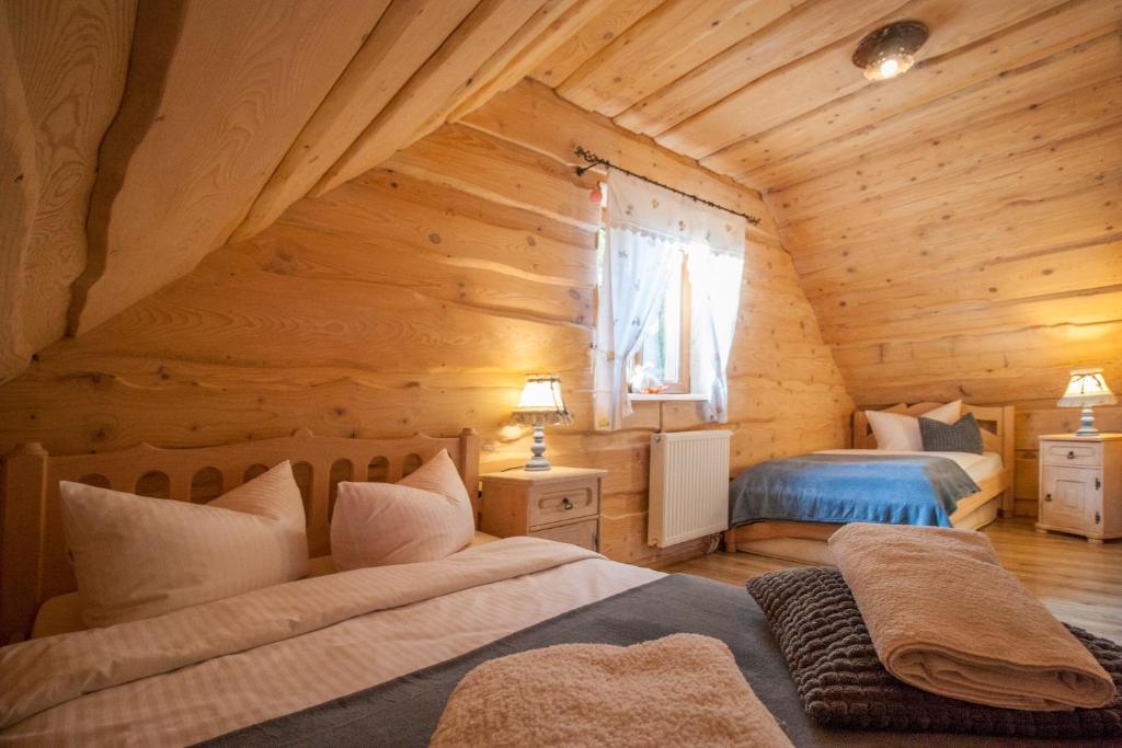 Postel nebo postele na pokoji v ubytování Chatka Ustrzyki