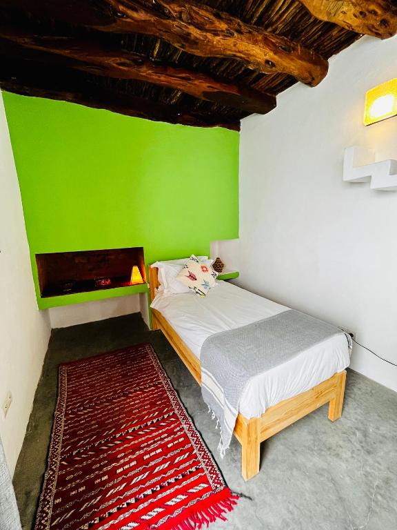 Postel nebo postele na pokoji v ubytování Riad Dar Sebta