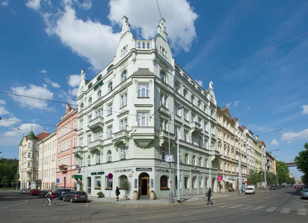 a large white building on a city street at Union Hotel Prague in Prague