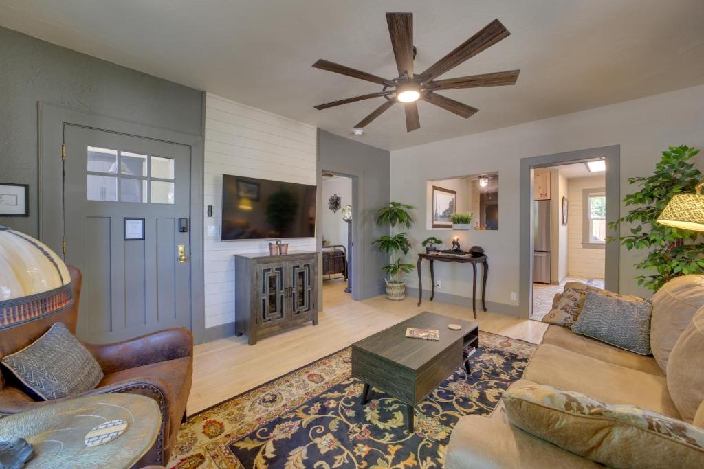 a living room with a couch and a ceiling fan at Charming Clarkdale Home - Half Mi to Downtown! in Clarkdale