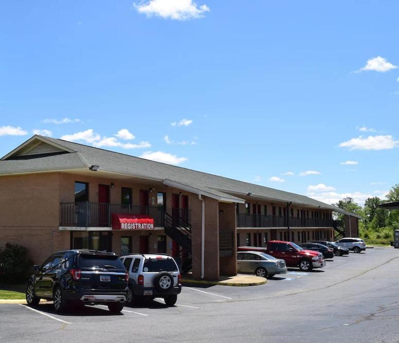 a parking lot in front of a hotel at Richburg Inn in Richburg