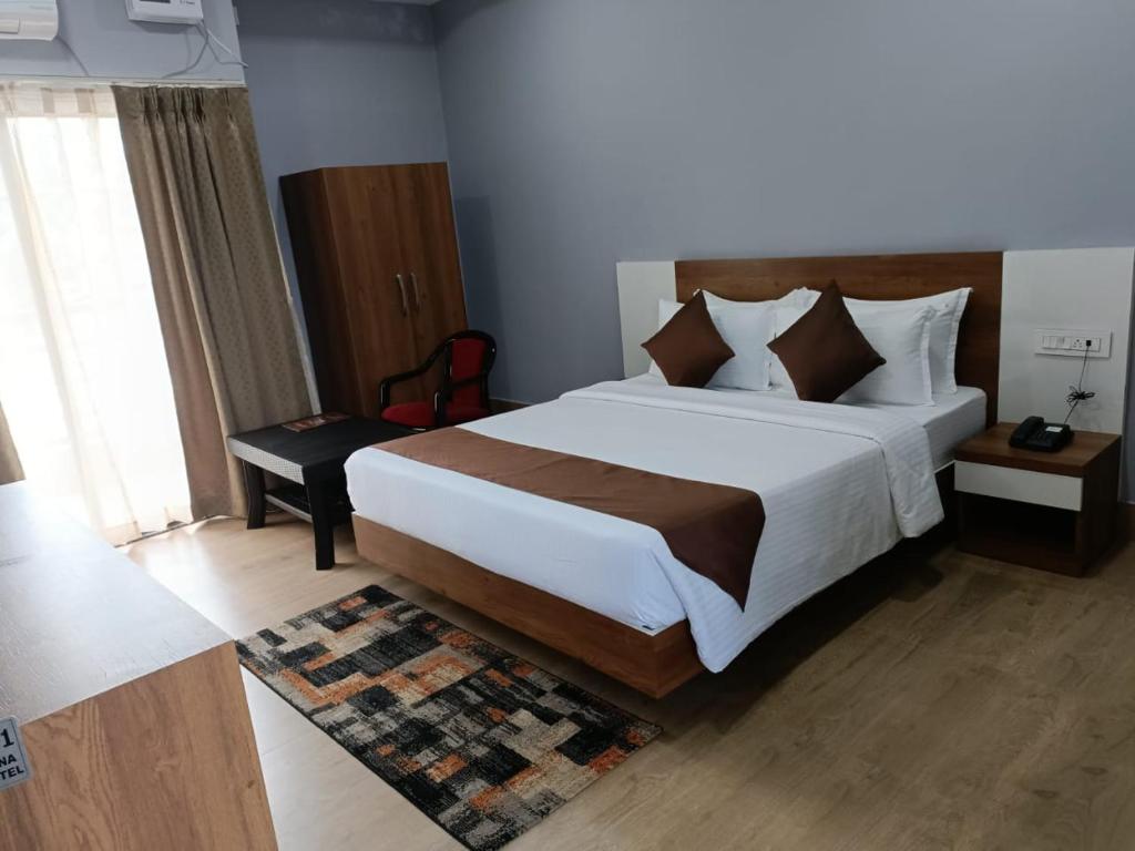 Postel nebo postele na pokoji v ubytování Hotel Balgopal