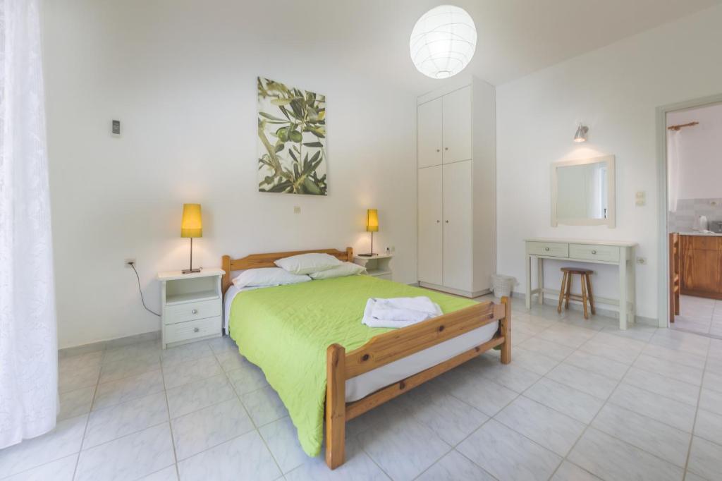 Postel nebo postele na pokoji v ubytování Olive Grove Apts