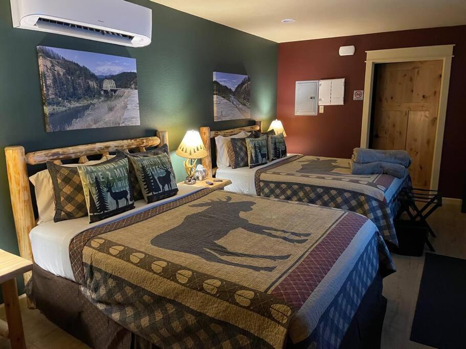 a hotel room with two beds in a room at Cedar Mountain Suite D in Grants Pass