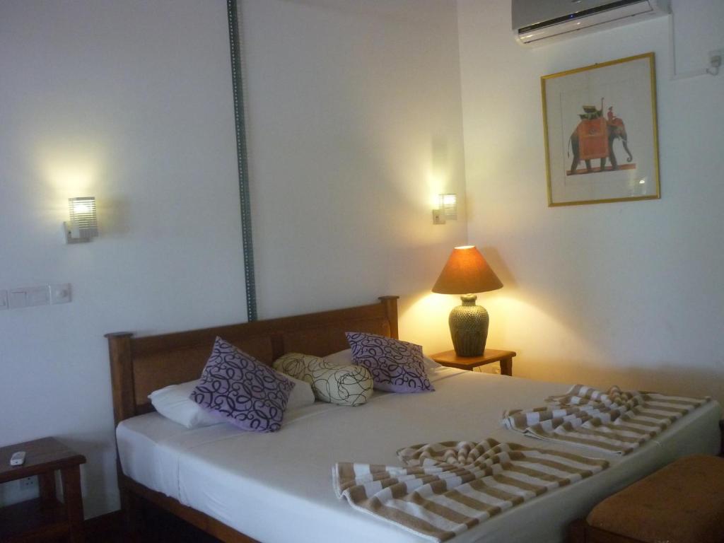 Postel nebo postele na pokoji v ubytování Laluna Ayurveda Resort