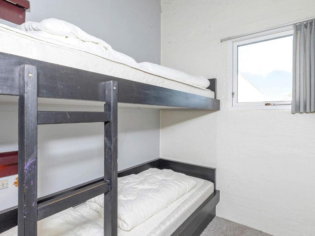 Postel nebo postele na pokoji v ubytování Apartment Brovst XII