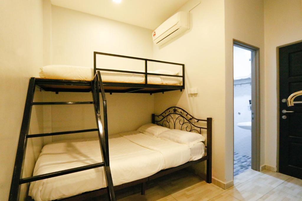 Postel nebo postele na pokoji v ubytování Travelland Hotel