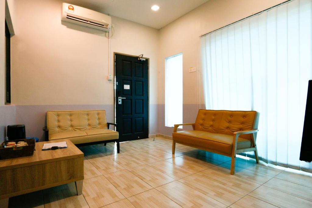 Posezení v ubytování Travelland Hotel