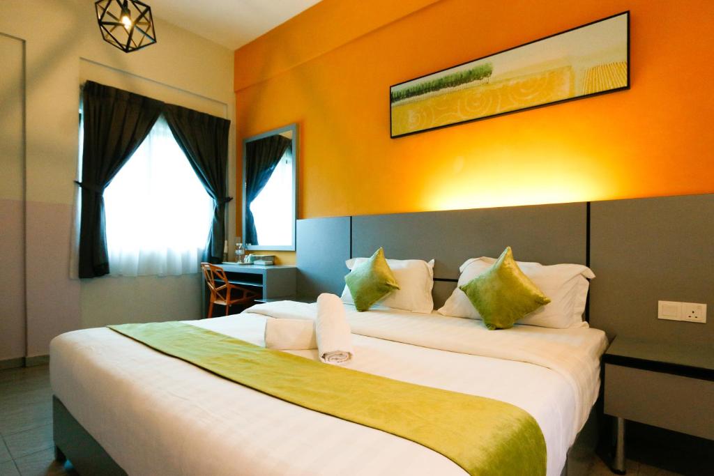 Postel nebo postele na pokoji v ubytování Travelland Hotel