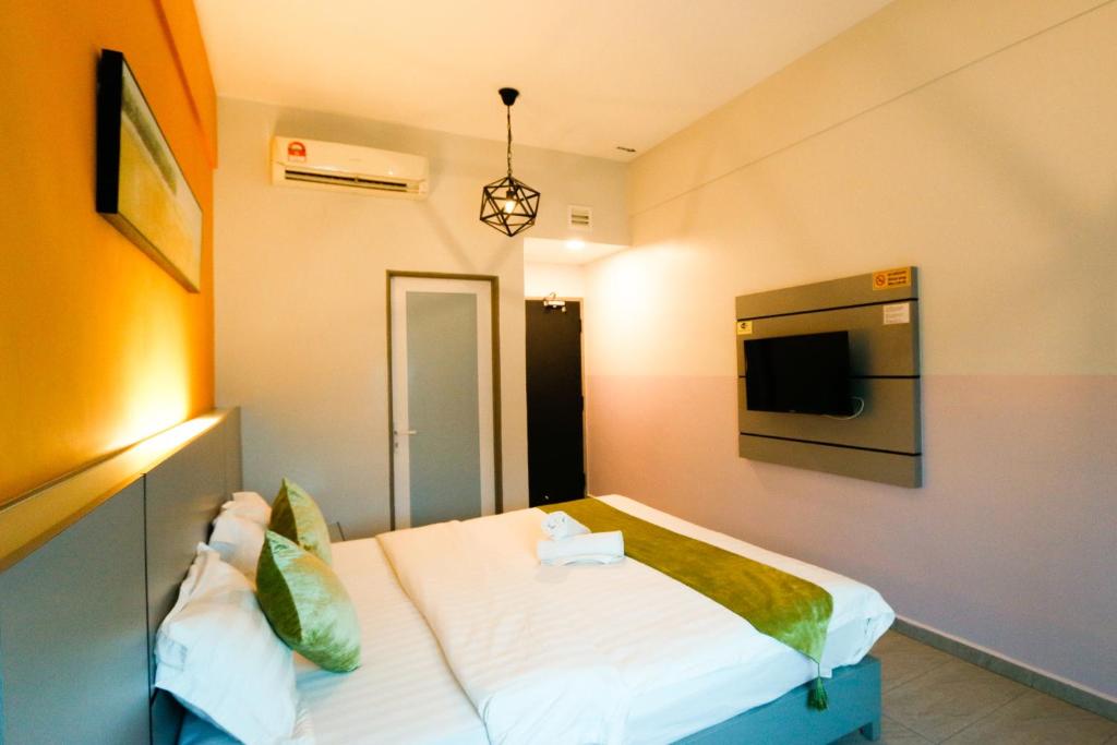 Postel nebo postele na pokoji v ubytování Travelland Hotel