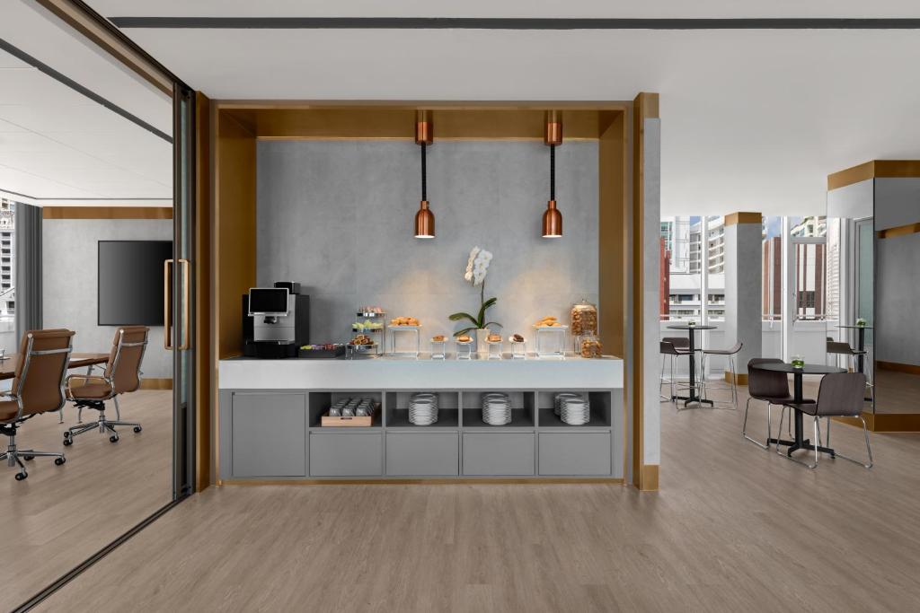A breakfast buffet station serving a shared lounge and meeting area.