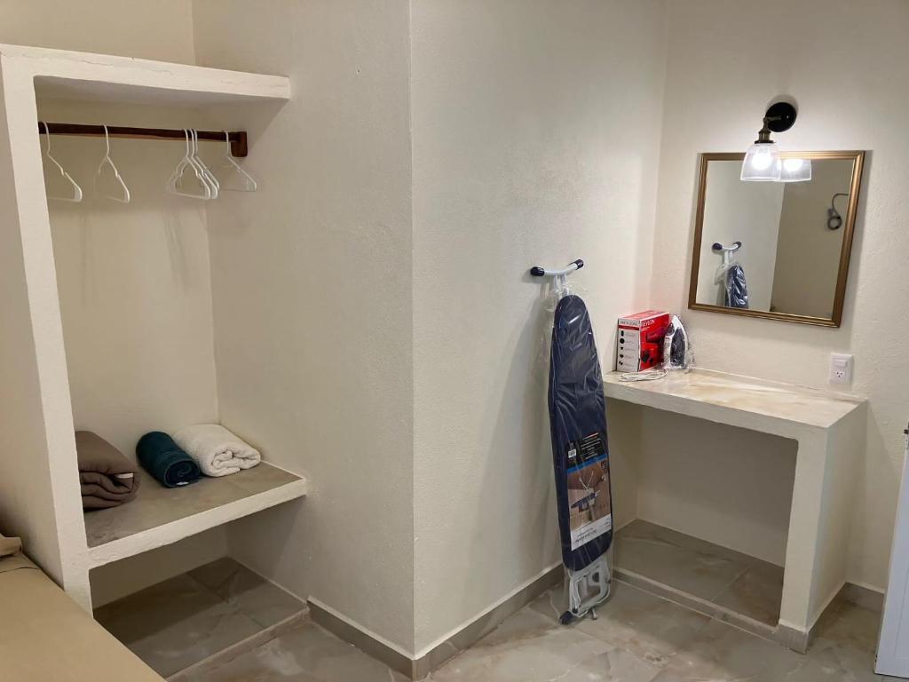 a bathroom with a sink and a mirror at Los Amores Apartments A in Pérula