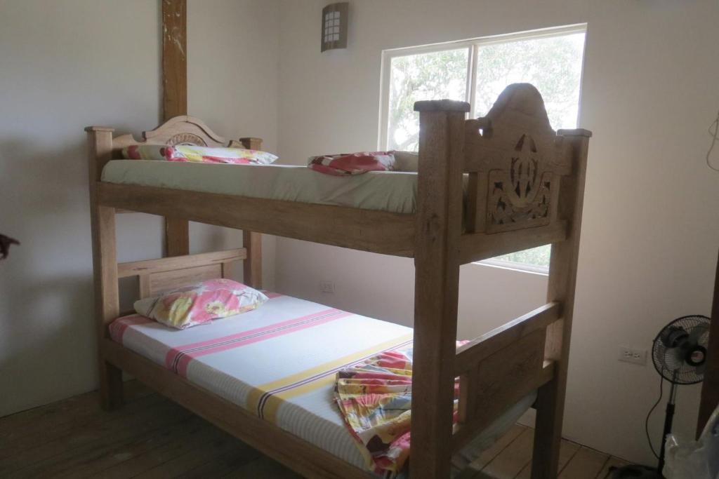 two bunk beds in a room with a window at Los Flamingos Vip in Santa Rosa