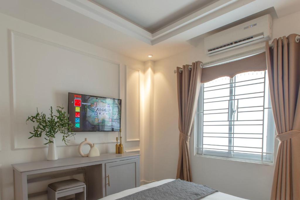 TV a/nebo společenská místnost v ubytování Keypad Hotel - 87 Nguyễn Khang