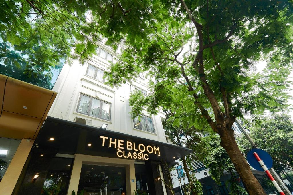 a building with a sign that reads the bloom casino at The Bloom Classic - Hotel and Bistro in Hanoi