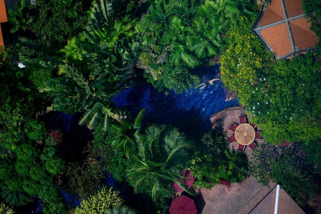 an overhead view of a garden with a house and trees at Sheraton Grande Sukhumvit, a Luxury Collection Hotel, Bangkok in Bangkok