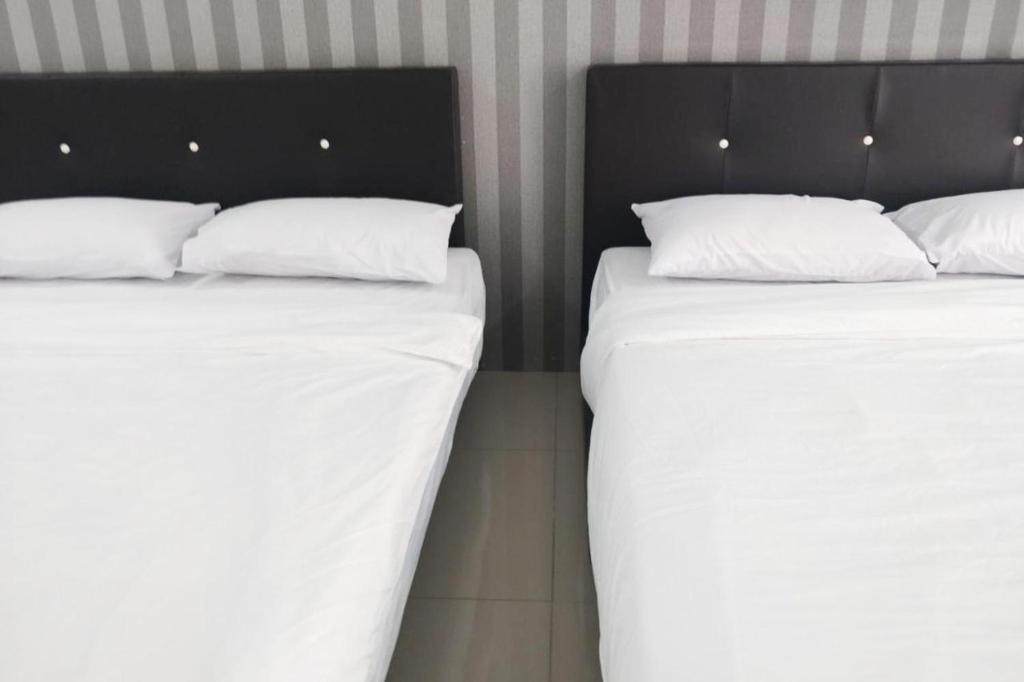 Postel nebo postele na pokoji v ubytování Summer Hotel