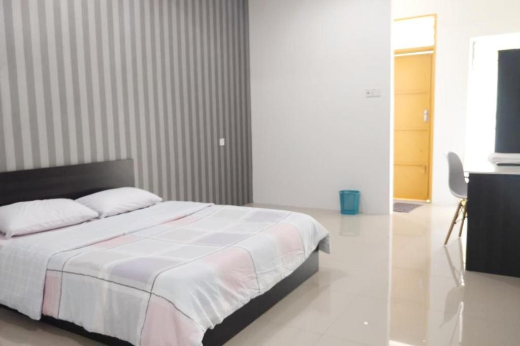 Postel nebo postele na pokoji v ubytování Summer Hotel