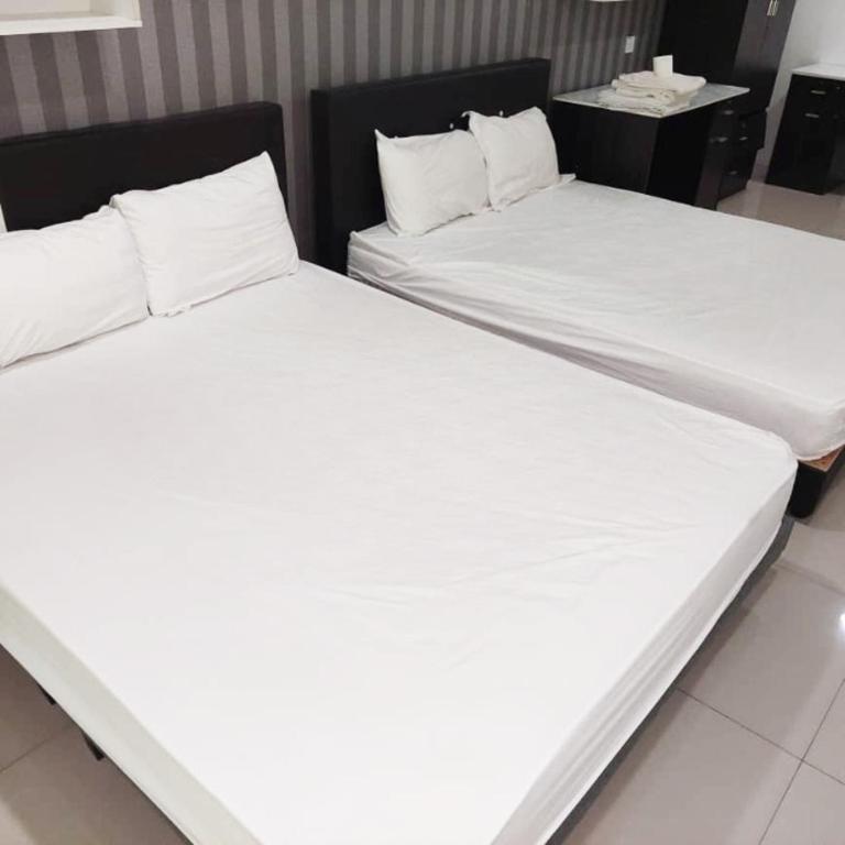 Postel nebo postele na pokoji v ubytování Summer Hotel
