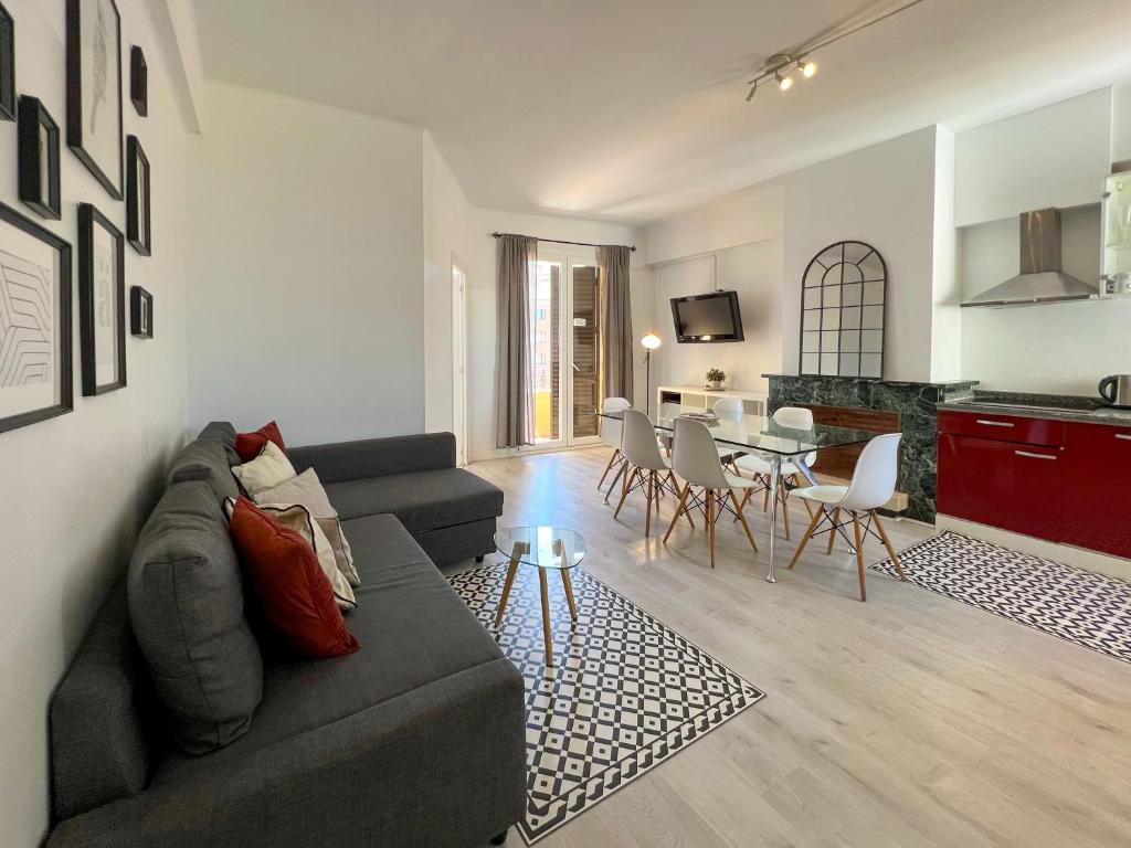 a living room with a couch and a table at Stay U-nique Apartments Sèneca in Barcelona