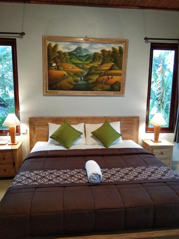 Postel nebo postele na pokoji v ubytování Merta Ubud Homestay