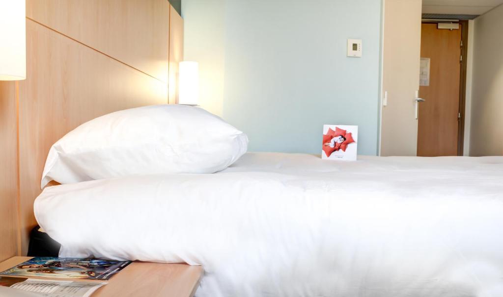 Postel nebo postele na pokoji v ubytování ibis Soissons