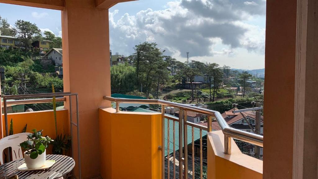 a balcony with a view of a city at EMILIEZ PLACE in Baguio