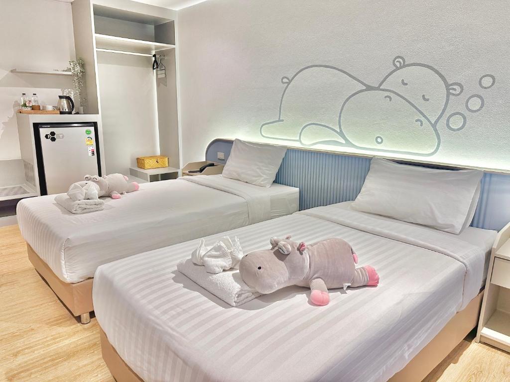 Postel nebo postele na pokoji v ubytování Herma Hotel