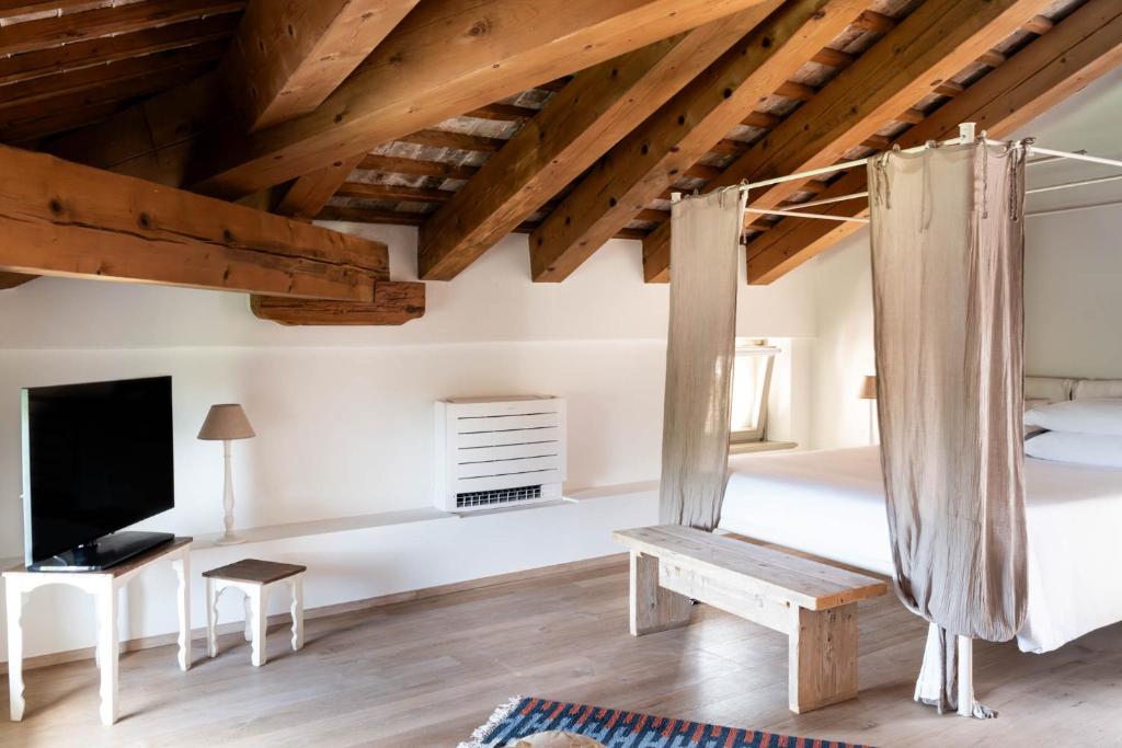 Postel nebo postele na pokoji v ubytování Castello di Buttrio