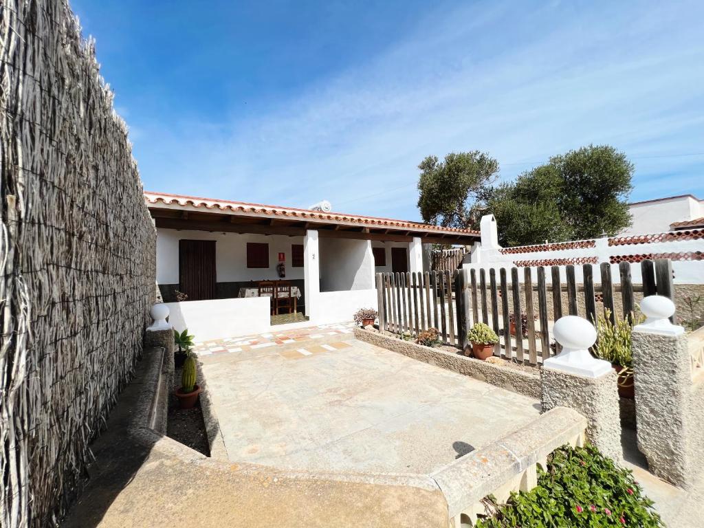 a house with a fence and a patio at CASA VICENTE FUENTE in San Ferrán de ses Roques
