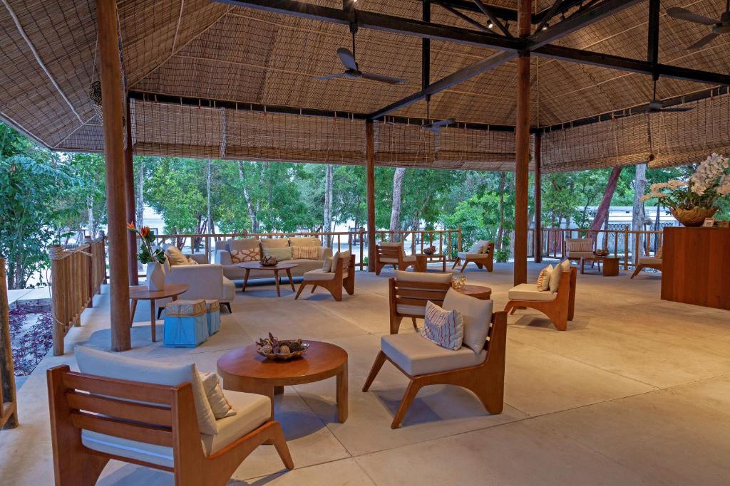 a large room with chairs and tables and a large umbrella at ISLAND CENTER POINT in Koh Rong Sanloem