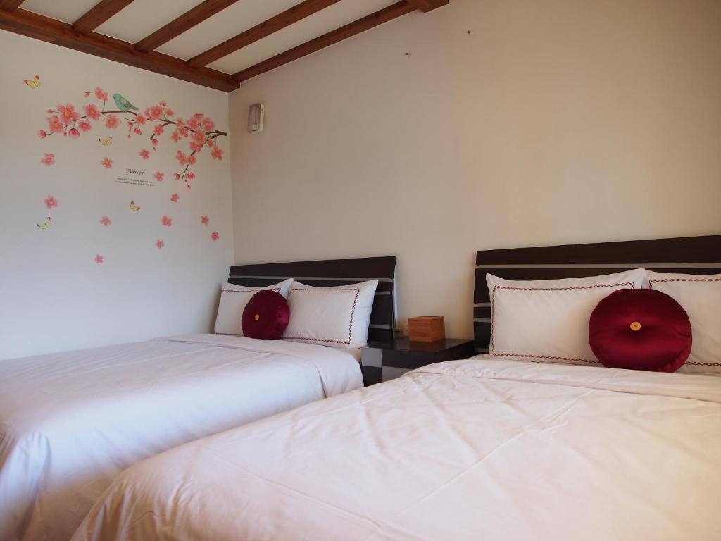 Postel nebo postele na pokoji v ubytování SunRise 23.5N B&B