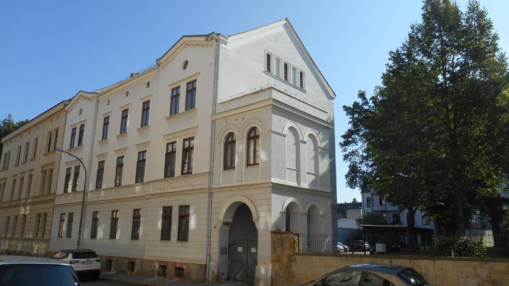 a large white building with a clock tower at Zum Senckenberg in Görlitz