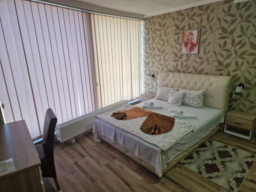 Postel nebo postele na pokoji v ubytování Hotel Saradis