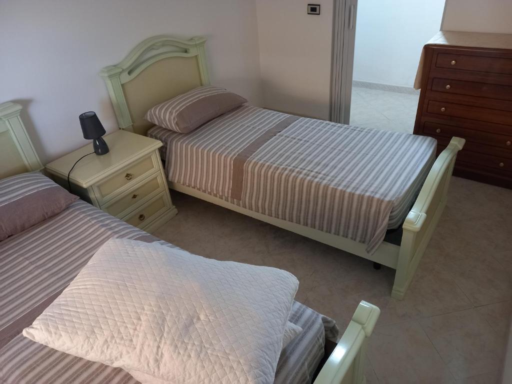 מיטה או מיטות בחדר ב-Villa Gioia