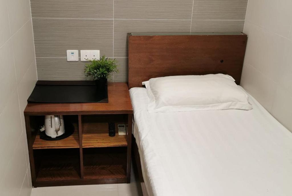 Postel nebo postele na pokoji v ubytování 香港百乐宾馆 Best Guesthouse