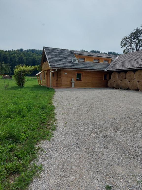 a large building with a lot of logs at Apartma Markelj in Radovljica