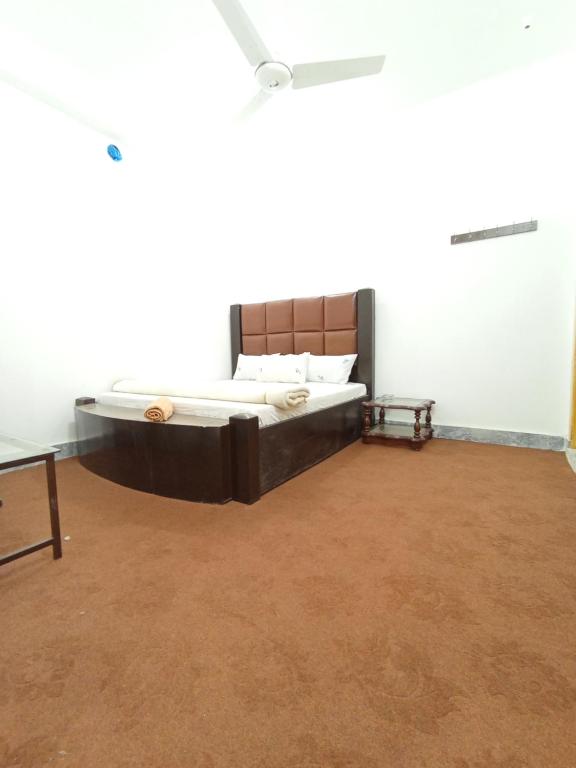 a bedroom with a large bed in a white room at Super luxury apartments in Mingāora