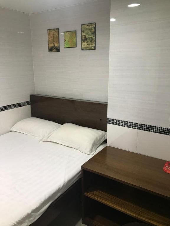 Postel nebo postele na pokoji v ubytování 香港百乐宾馆 Best Guesthouse