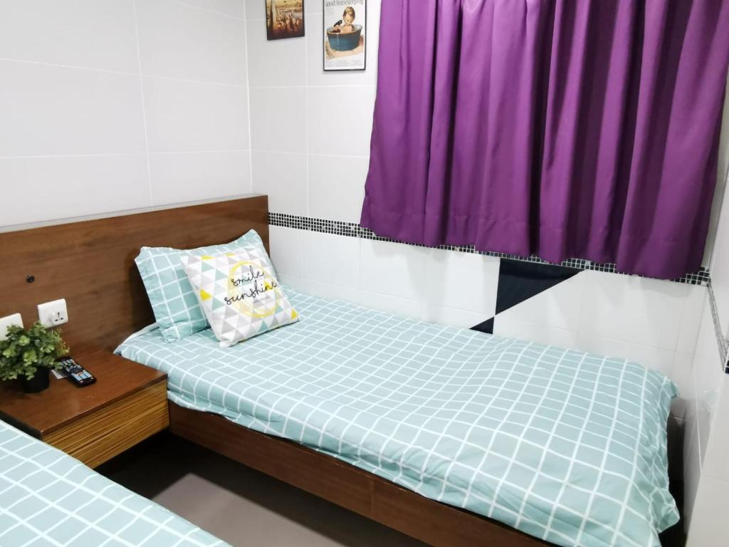 Postel nebo postele na pokoji v ubytování 香港百乐宾馆 Best Guesthouse