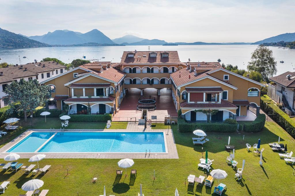 an aerial view of a house with a swimming pool at Aquarama - By Impero House in Feriolo