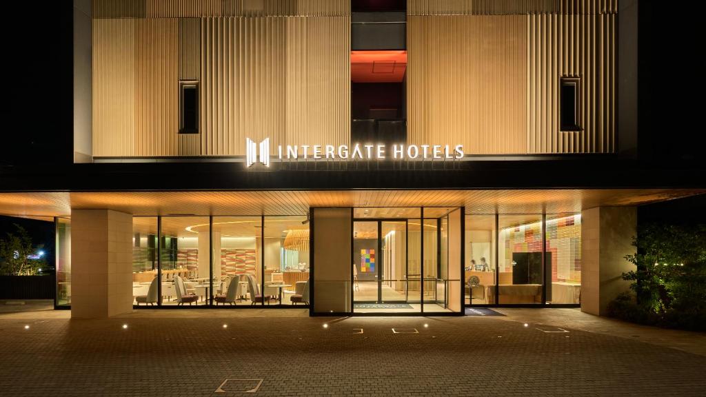 a building with the entrance to a hotel at night at Hotel Intergate Kanazawa in Kanazawa
