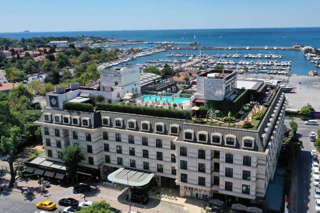an aerial view of a building with a marina at Wyndham Grand Istanbul Kalamış Marina Hotel in Istanbul