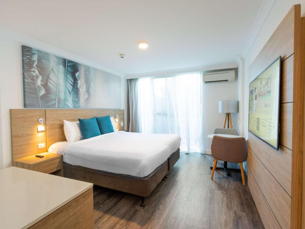 Postel nebo postele na pokoji v ubytování Novotel Cairns Oasis Resort