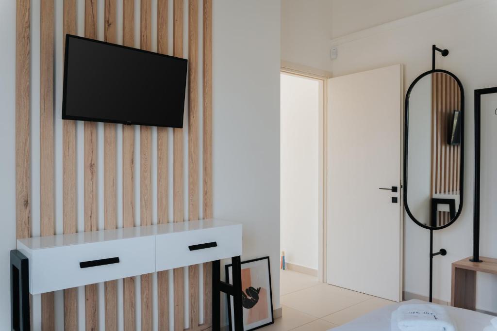 TV a/nebo společenská místnost v ubytování Ponte Suites